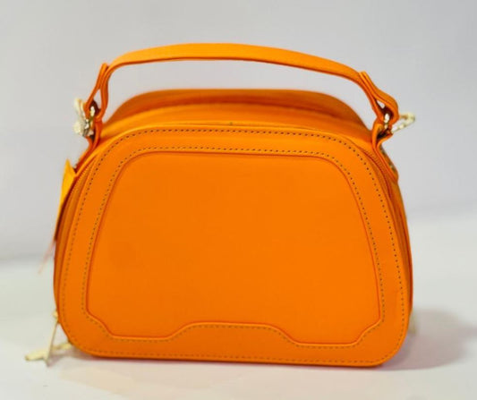 Orange colored Leather women's hand bag